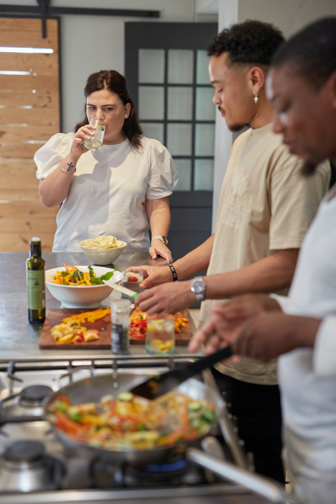 Colleagues cooking together during a culinary team building workshop