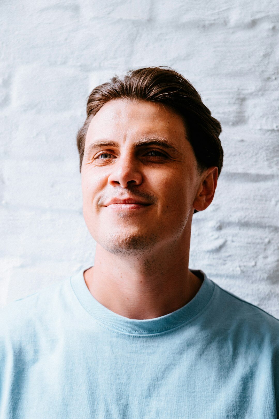 Studio portrait of a smiling European man event facilitator